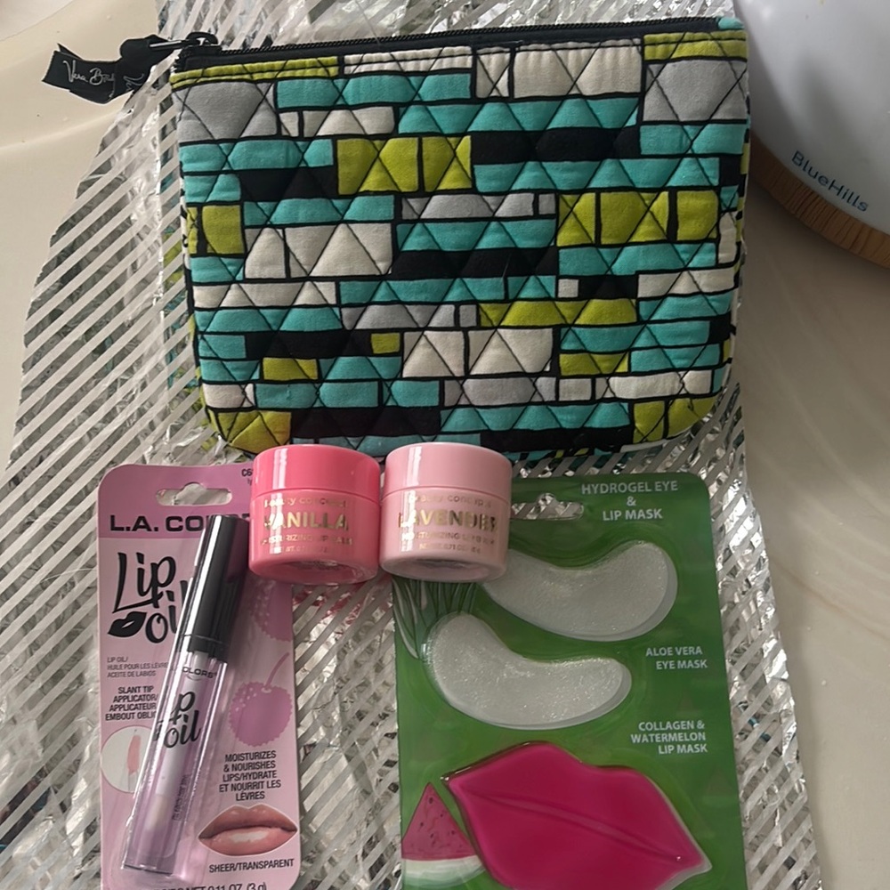 Vera Bradley Triangular Pattern Cosmetic Bag with lip care set and eye mask